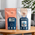 Two packages of 'Happy Heart' and 'Sugar Balance' on a wooden table with a blurred indoor background.