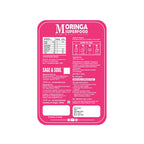 A pink rectangular label with rounded corners on a white background, displaying product information for Moringa Superfood Sage & Soul. The label contains nutritional facts, usage instructions, ingredients, manufacturer details, and a white fill box area at the bottom.